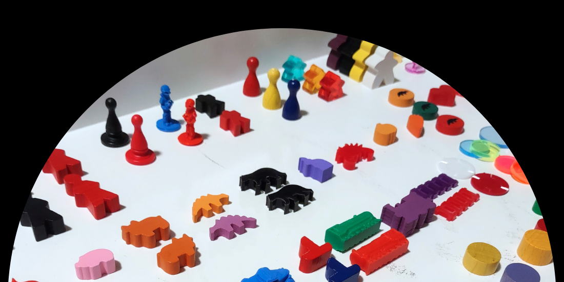 Game pieces spread across table